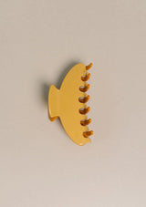 [Color: Citrus] An image of a large yellow two tone hair claw clip from Nat and Noor. 