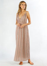 [Color: Red/Black] A front facing image of a blonde woman wearing a striped maxi dress with a deep v neckline, a smocked waist, a side slit, and adjustable spaghetti straps.