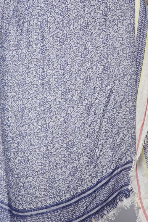 [Color: Blue] A detail image of blue printed boho scarf with frayed edges.