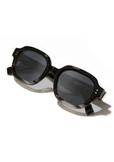 [Color: Black Agate] Oval black and grey ombre acetate sunglasses.