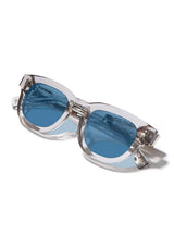 [Color: Ice Water]: Thick sunglasses with a blue lens in a light grey  tone acetate frame. Designed in Italian cellulose acetate with stainless steel temples.
