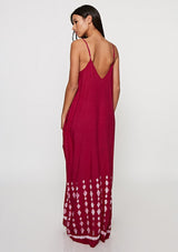 [Color: Wine] Woman wearing a burgundy bohemian maxi dress with a border print. Featuring a relaxed silhouette, a v neckline, adjustable spaghetti straps, and side pockets. 