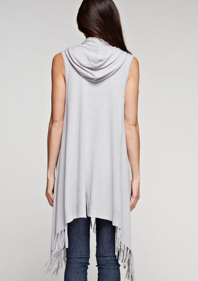 [Color: Heather Silver] A woman wearing a hooded knit fringe vest. Featuring a trending fringed hemline and an easy open front.