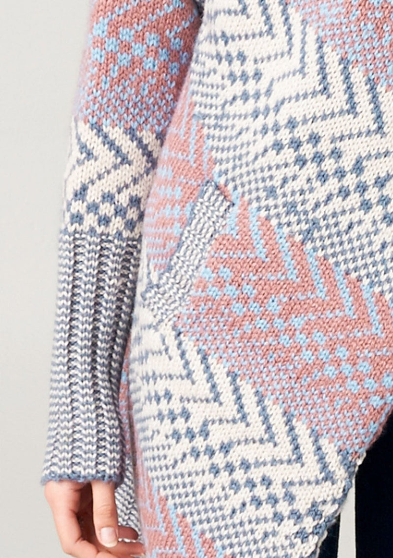 [Color: Ivory/Ocean/Rose] A blonde model wearing a boho striped cardigan with a cozy shawl collar and side pockets. A statement boho cardigan for the fall season. 