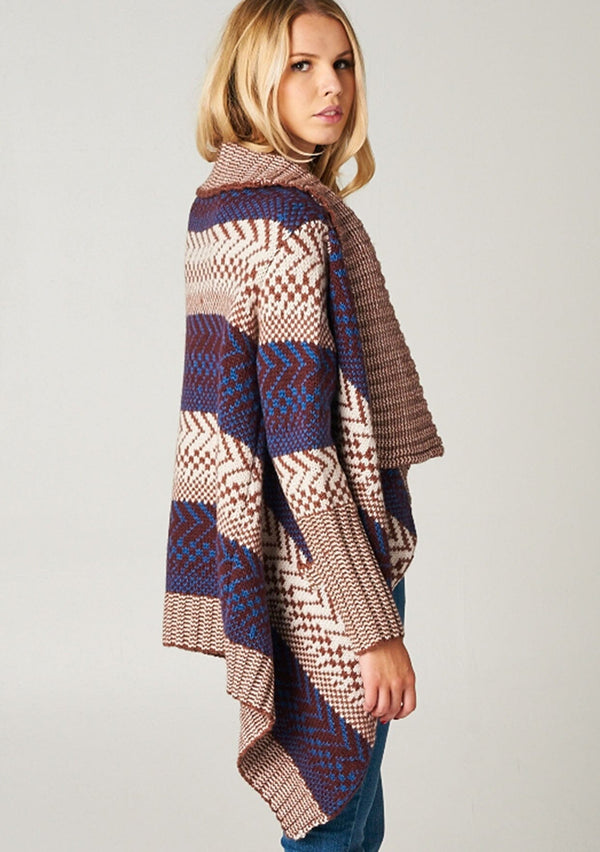 [Color: Maroon/Ivory/Blue] A blonde model wearing a boho striped cardigan with a cozy shawl collar and side pockets. A statement boho cardigan for the fall season. 