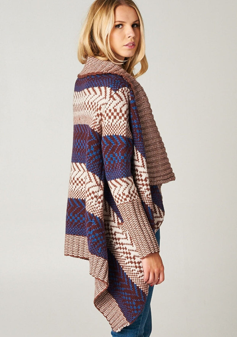 [Color: Maroon/Ivory/Blue] A blonde model wearing a boho striped cardigan with a cozy shawl collar and side pockets. A statement boho cardigan for the fall season. 