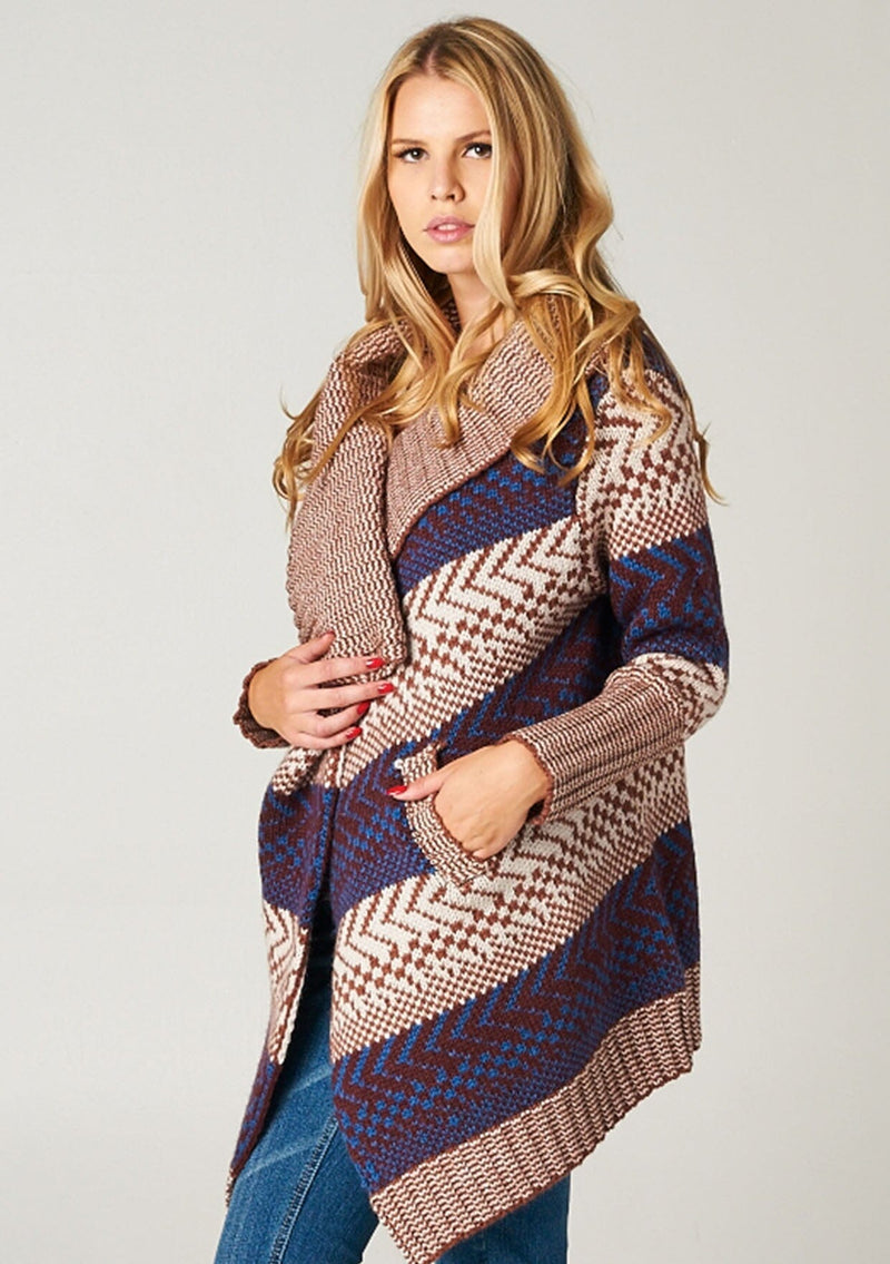[Color: Maroon/Ivory/Blue] A blonde model wearing a boho striped cardigan with a cozy shawl collar and side pockets. A statement boho cardigan for the fall season. 