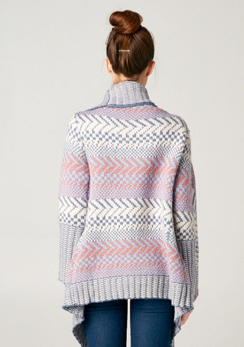 [Color: Ivory/Ocean/Rose] A blonde model wearing a boho striped cardigan with a cozy shawl collar and side pockets. A statement boho cardigan for the fall season. 