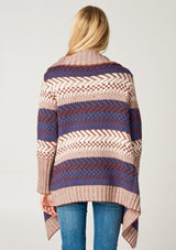 [Color: Maroon/Ivory/Blue] A blonde model wearing a boho striped cardigan with a cozy shawl collar and side pockets. A statement boho cardigan for the fall season. 