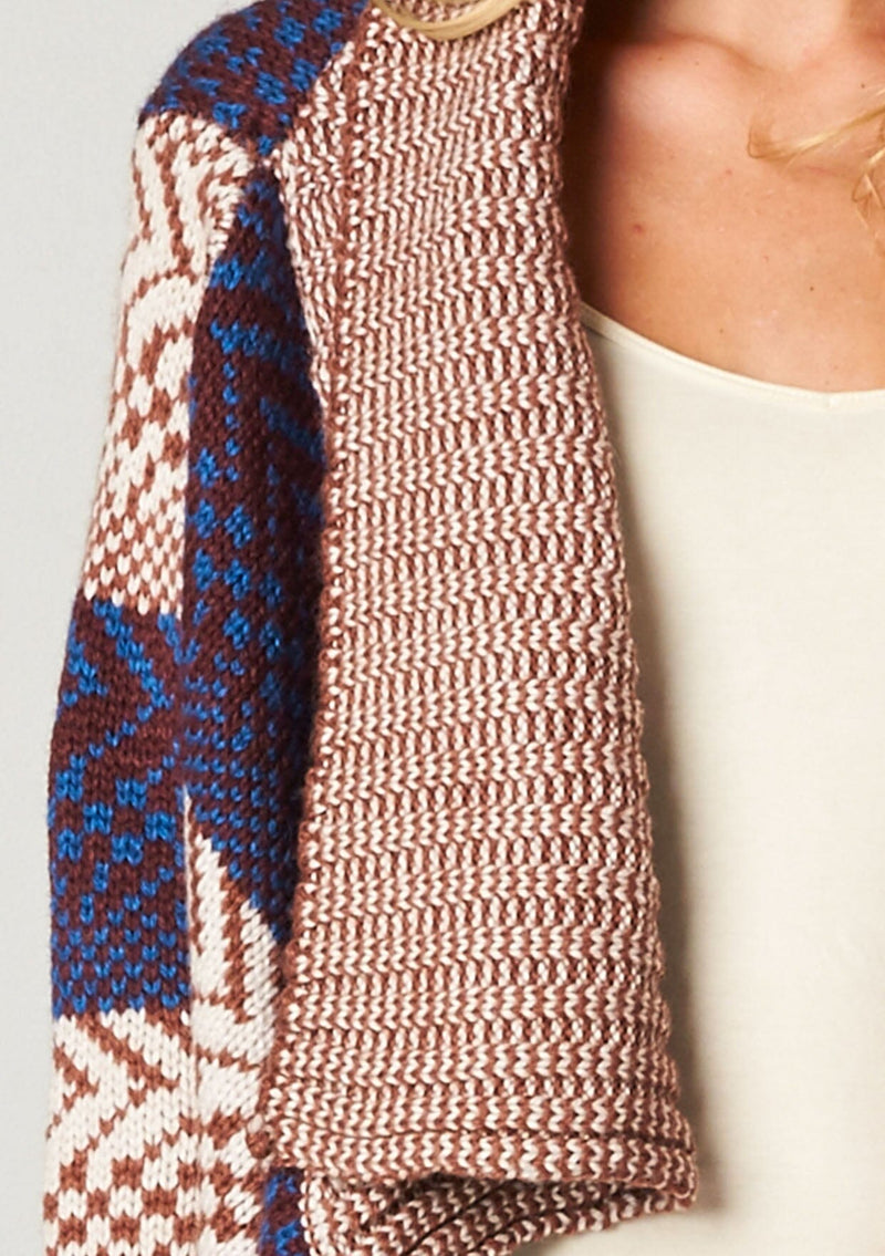 [Color: Maroon/Ivory/Blue] A blonde model wearing a boho striped cardigan with a cozy shawl collar and side pockets. A statement boho cardigan for the fall season. 