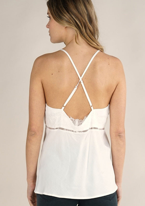 [Color: Chalk] A back facing image of a white lace trim cami with a flattering v-neckline, spaghetti straps, and cross back. Effortlessly chic and feminine for work and casual outings. 