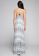 [Color: Black/Aqua/Multi] A back facing image of a brunette model wearing bohemian maxi dress with a blue geometric print, spaghetti straps, and a  racerback with tassel ties. 