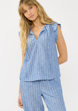 [Color: Blue] A front facing image of a blonde model wearing a blue striped top with a split v neckline, ties, and cap sleeves. Styled with a matching bottom. 