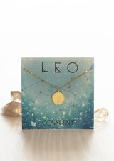 [Zodiac Sign: Leo] Gold necklace on an Leo-themed card with celestial design