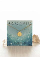 [Zodiac Sign: Scorpio] Gold necklace on an Scorpio-themed card with celestial design