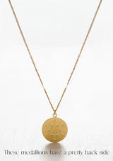 [Zodiac Sign: Aries] Gold necklace with a medallion on a white background