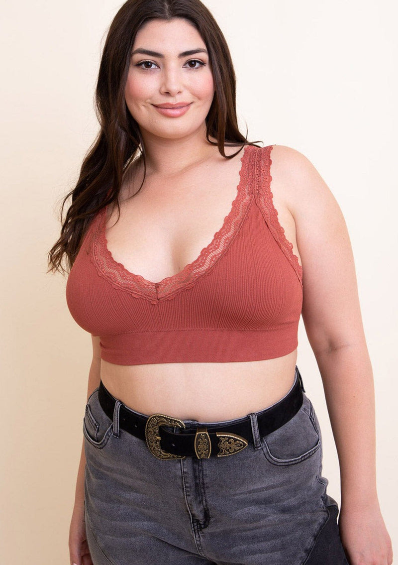 [Color: Black] A front facing image of a brunette model wearing a vintage-inspired western buckle belt. 