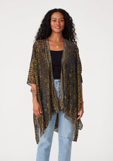 [Color: Gold/Dark Indigo] A front facing image of a brunette model wearing a gold bohemian duster kimono with a dark indigo velvet burnout design. A special occasion kimono with half length sleeves and an open front. 