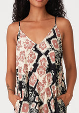 [Color: Black/Dusty Rose] A close up front facing image of a brunette model wearing a best selling black and pink bohemian printed maxi dress. With adjustable spaghetti straps, a deep v neckline in front and back, a flowy, oversize cocoon fit, and side pockets.