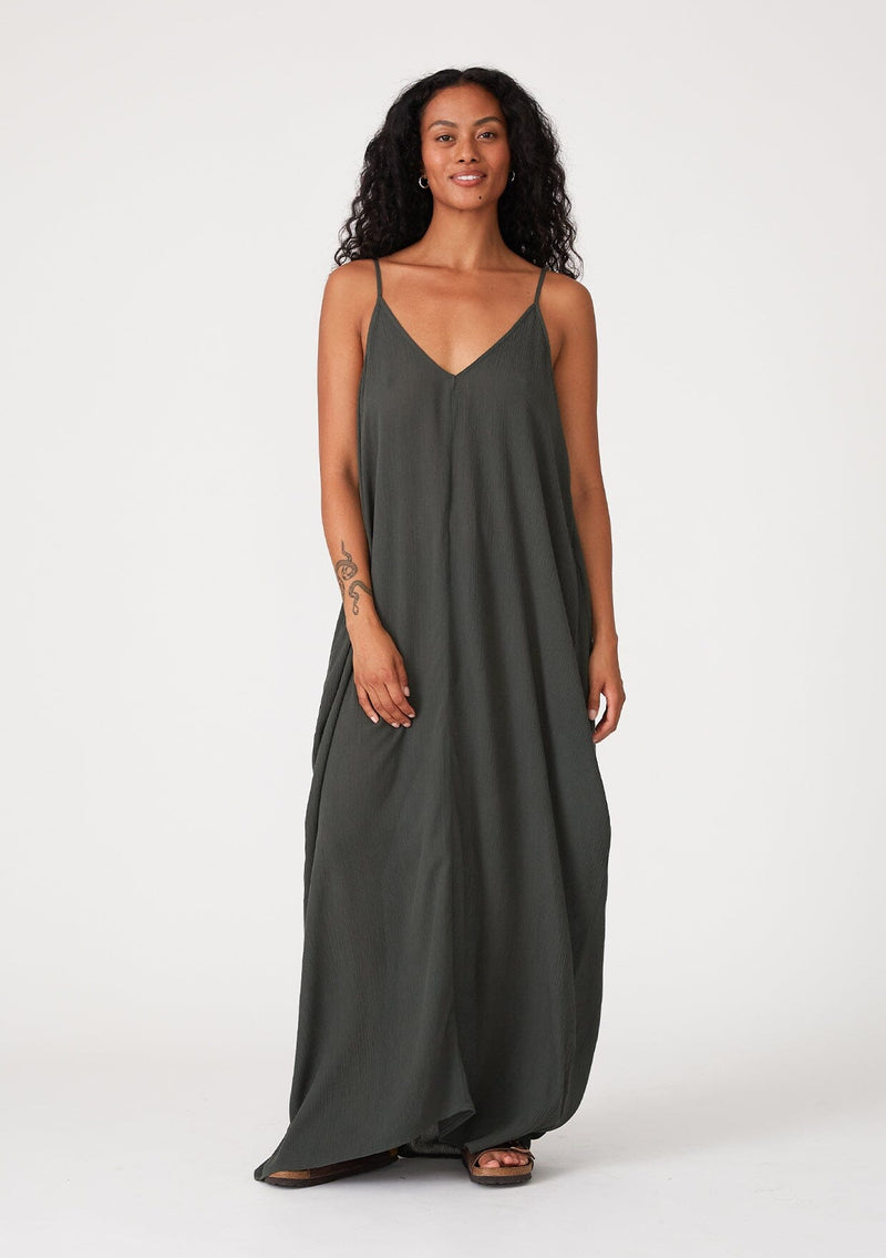 [Color: Military] An army green harem maxi dress. This billowy maxi tank top dress features a deep v neckline, adjustable spaghetti straps, and a cocoon fit.