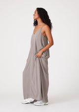 [Color: Cement] A grey harem maxi dress. This billowy maxi tank top dress features a deep v neckline, adjustable spaghetti straps, and a cocoon fit.