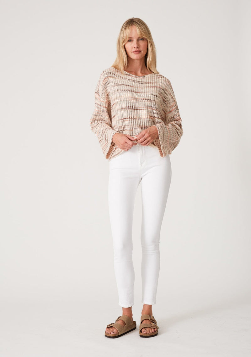 [Color: Dusty Blush] A full body front facing image of a blonde model wearing a cropped bohemian sweater in a pink and brown multi color space dye knit. With long bell sleeves and a wide boat neckline.