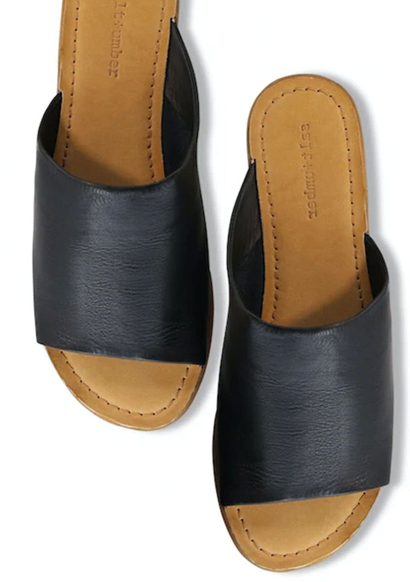 [Color: Black] A timeless black leather slide sandal, ethically and sustainably made in India. 