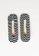 [Color: Black/White] A black and white checkered hair clip set from Nat and Noor. 
