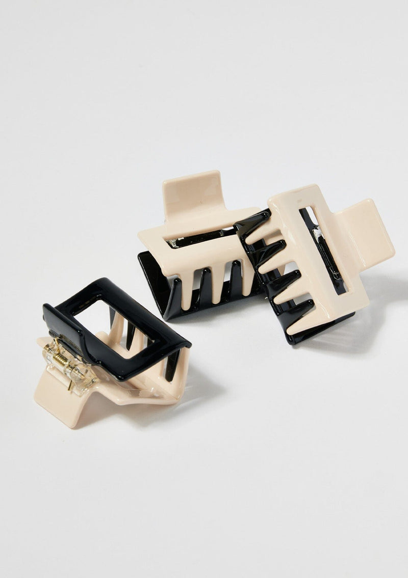 [Color: Black/Beige] A black and ivory two tone hair claw clip made with sustainable cellulose acetate.