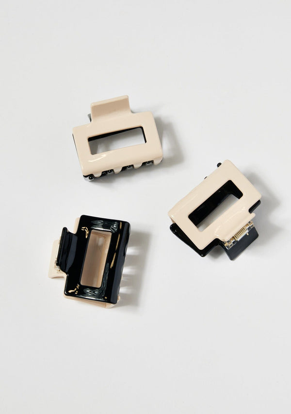 [Color: Black/Beige] A set of three black and ivory two tone hair claw clips made with sustainable cellulose acetate.