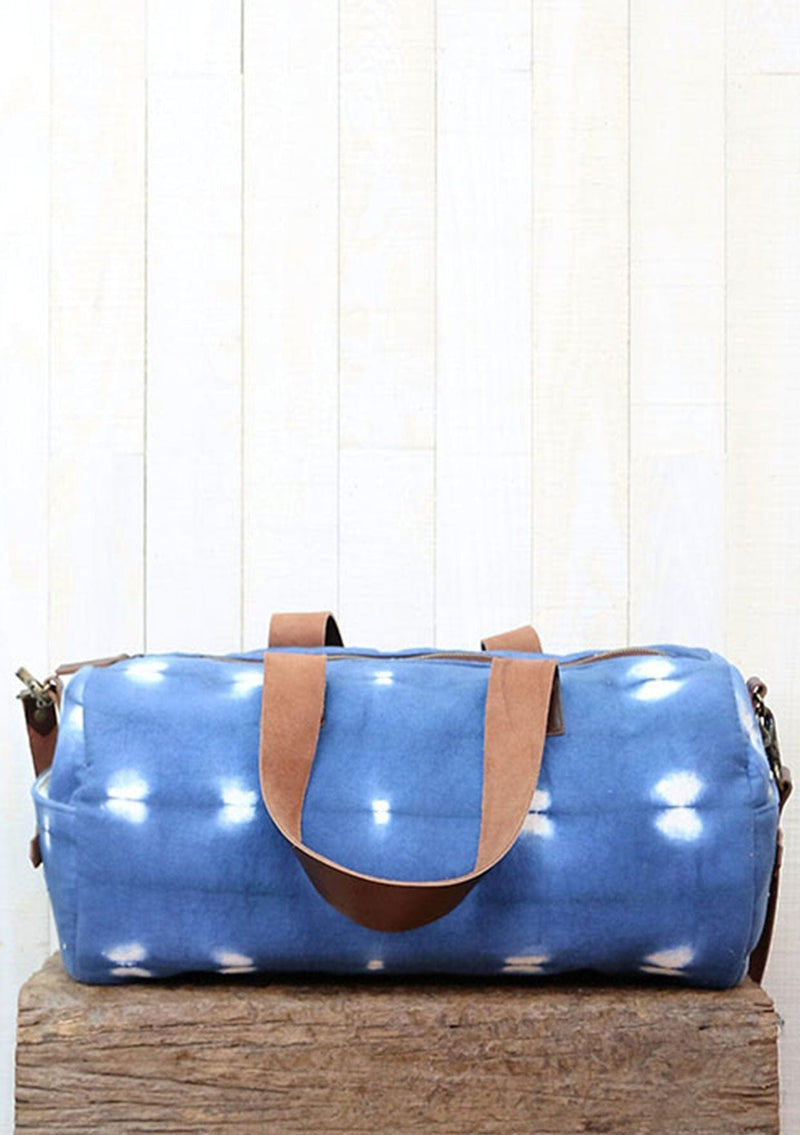 [Color: Blue/OffWhite] Blue tie dyed duffel bag. 