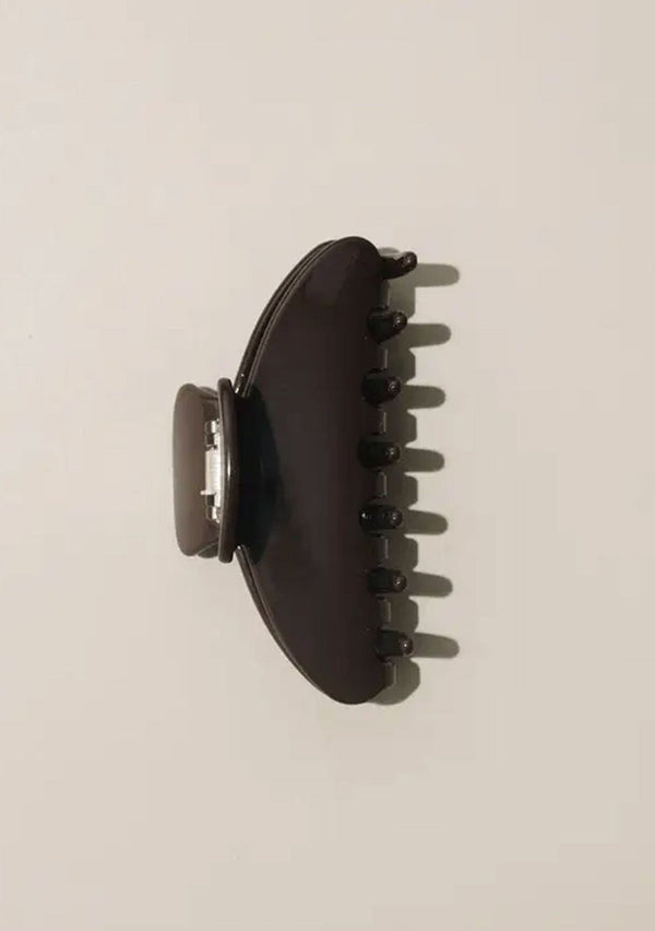 [Color: Chocolate] A chocolate brown medium sized hair clip by Nat and Noor. 