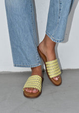 [Color: Citron/Gold] A yellow and gold leather woven slide sandal. Sustainably hand made in small batches. 