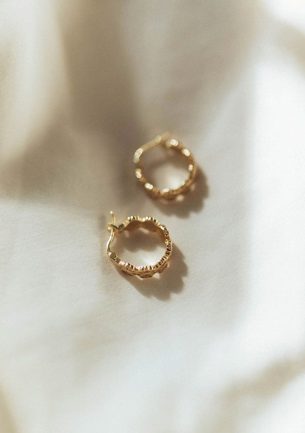Cute hypoallergenic flower print hoop earrings, made with fourteen karat gold plated sterling silver base. Made in the USA. 