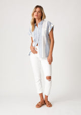 [Color: White/Blue] A full body front facing image of a blonde model wearing a white and blue striped shirt with short cuffed sleeves, a button front, a classic collared neckline, and a front patch pocket.