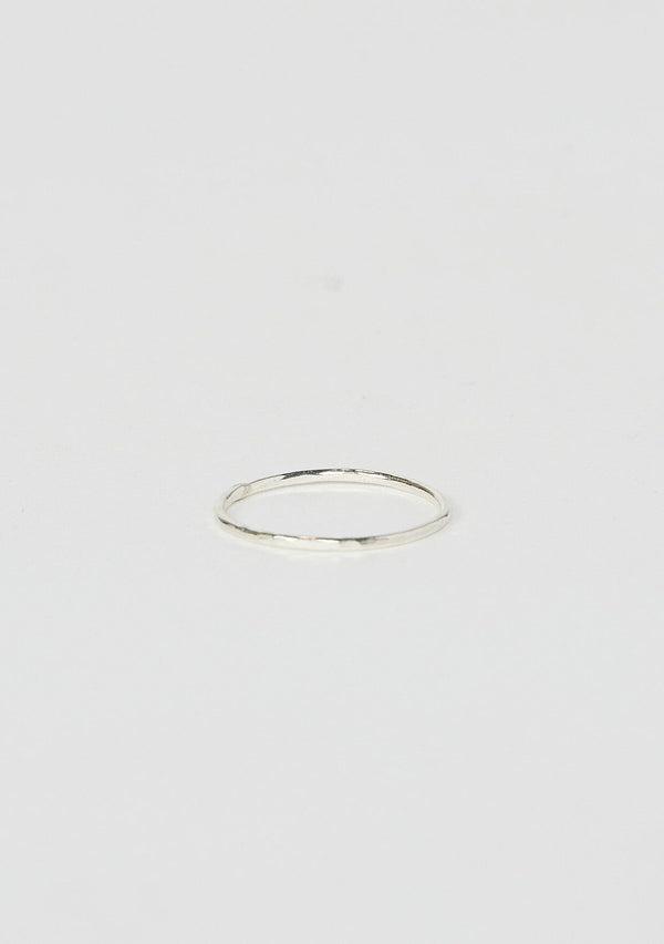 [Color: Silver] A thin hammered stacking ring hand made from sterling silver.