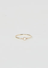 [Color: Opal] A delicate thin gold fill ring from Moon Pi jewelry, featuring a tiny opal accent.