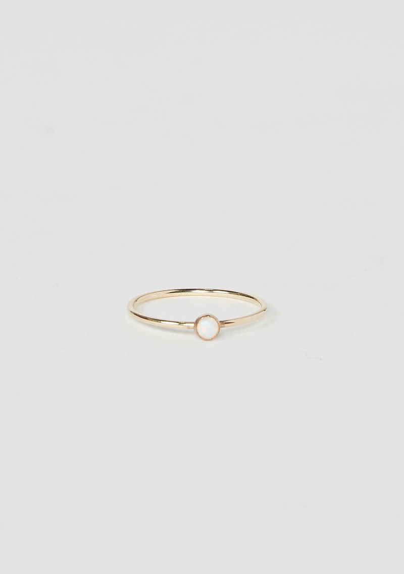 [Color: Opal] A delicate thin gold fill ring from Moon Pi jewelry, featuring a tiny opal accent.