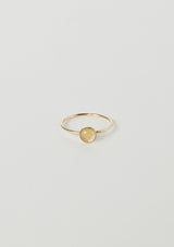 [Color: Quartz] A delicate thin gold fill ring from Moon Pi jewelry, featuring a golden quartz stone accent.