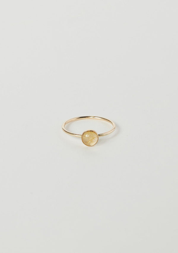 [Color: Quartz] A delicate thin gold fill ring from Moon Pi jewelry, featuring a golden quartz stone accent.