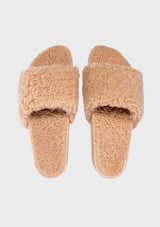 [Color: Sand] An image of a fuzzy shearling slide sandal in beige with a thick platform sole. Designed with sustainability in mind from Fleks footwear. 