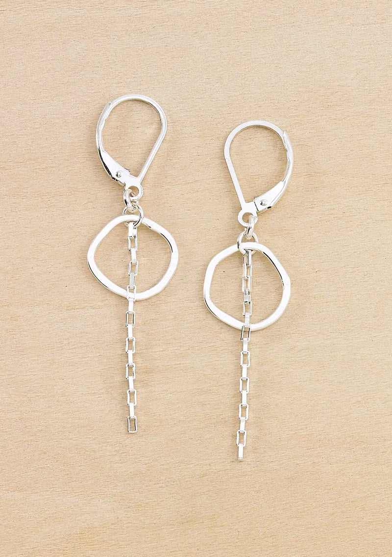 Pair of silver earrings with a small hammered circle and chain drop detail. Attached to a round wire lever back. 