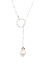 Sterling silver lariat necklace with a freshwater pearl  and circle pendant. An elegant y necklace for v-necklines. 