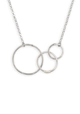 A sterling silver necklace with hammered interlocking circles suspended by a 16 inch chain. 