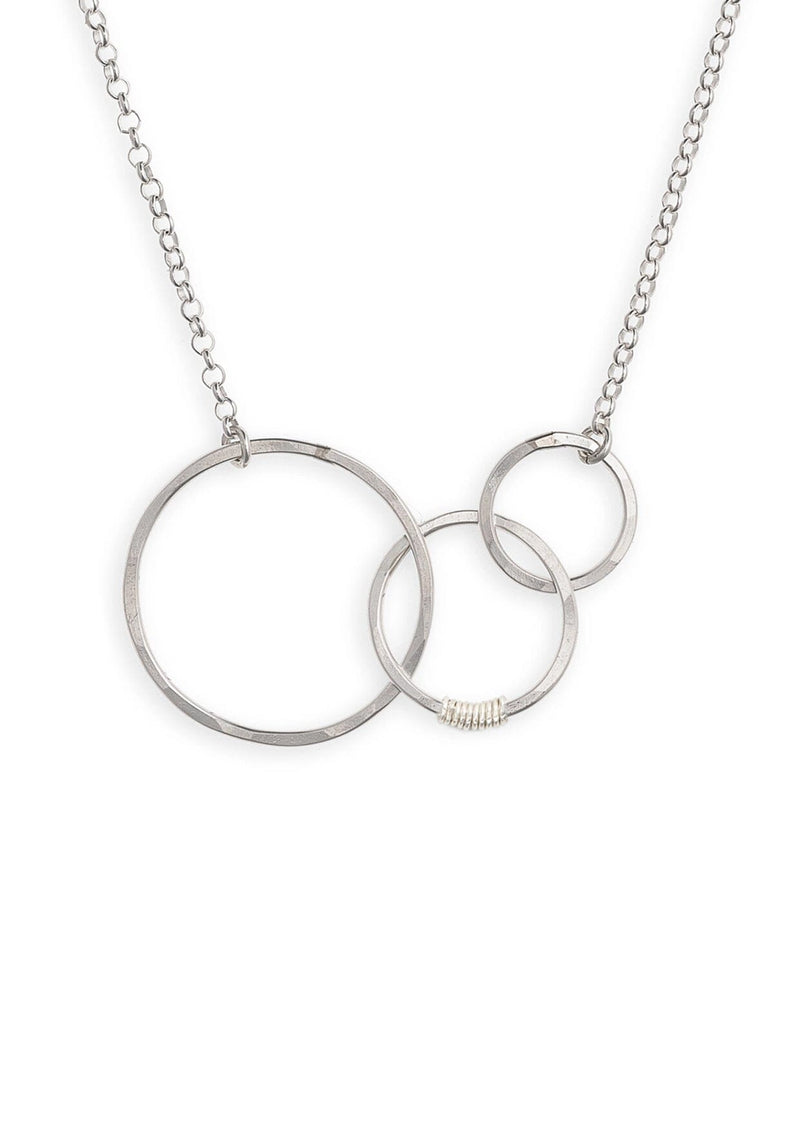 A sterling silver necklace with hammered interlocking circles suspended by a 16 inch chain. 