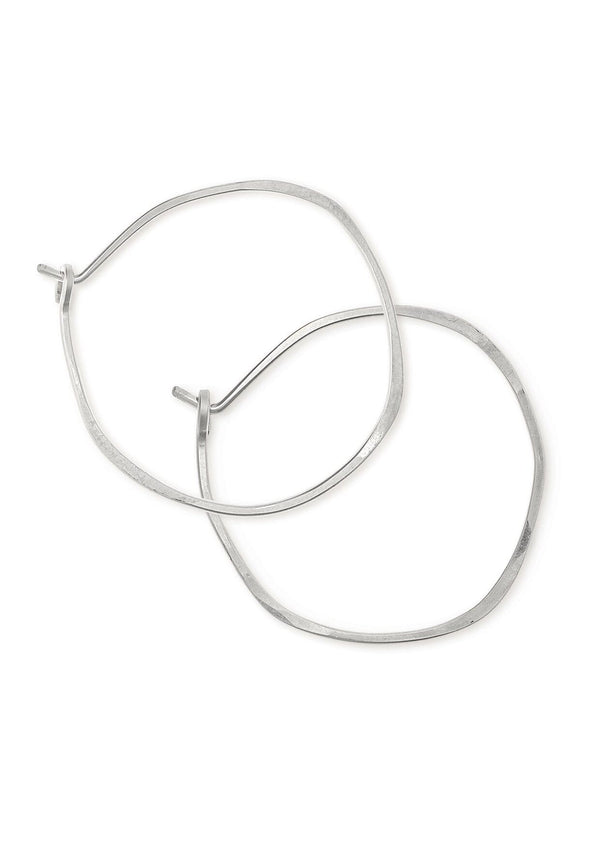 Sterling silver hoop earrings hammered into an imperfect circle.