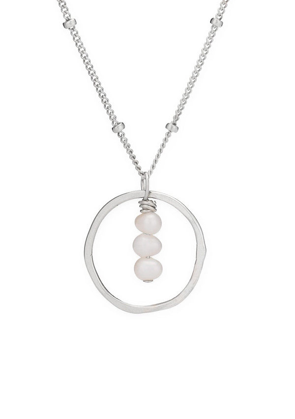 Sterling silver necklace with a circular pendant featuring three fresh water pearls suspended by a delicate beaded chain. 