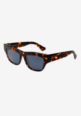 [Color: Tortoise] Sleek cat-eye sunglasses with a tortoise frame. 