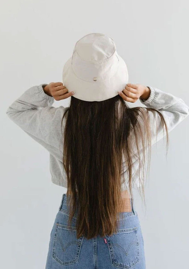 [Color: Cream] A nineties style cotton bucket hat by Gigi Pip. Fully packable and adjustable. 