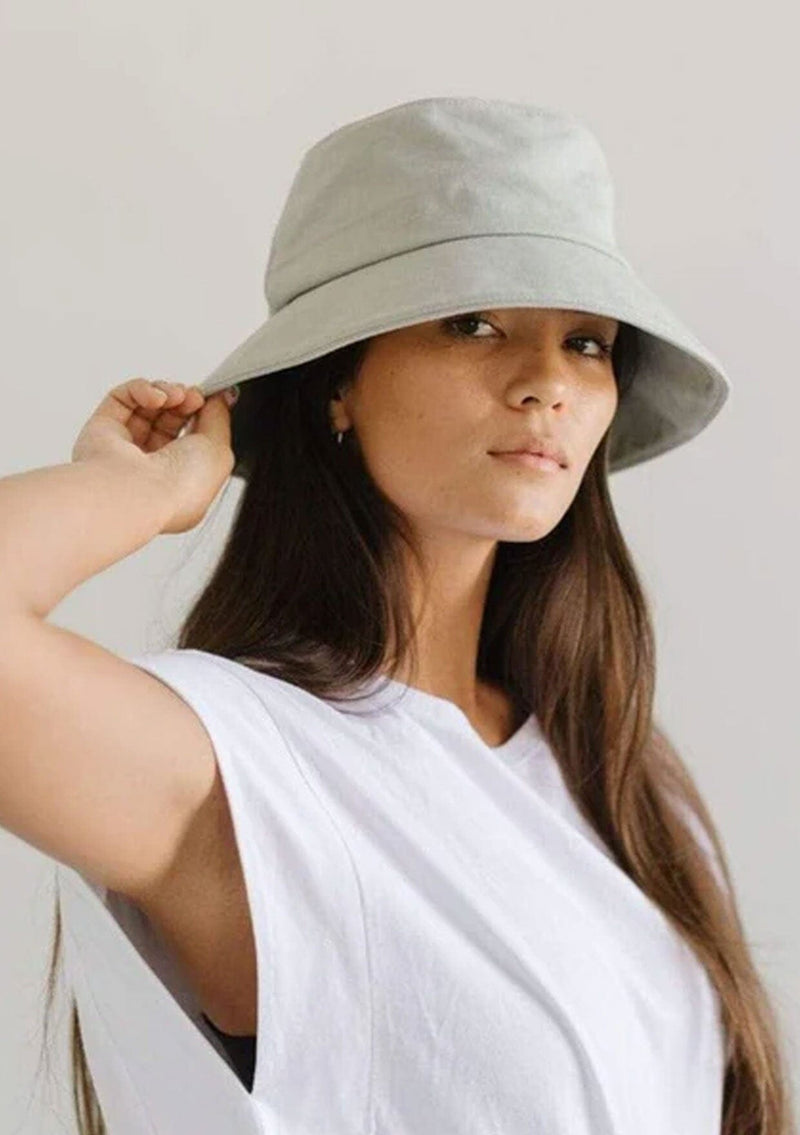 [Color: Sage] A nineties style cotton bucket hat by Gigi Pip. Fully packable and adjustable. 